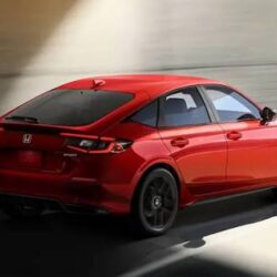Red Honda Civic hatchback driving in tunnel